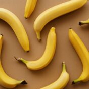Top view of ripe bananas arranged on a brown background, perfect for healthy eating concepts.